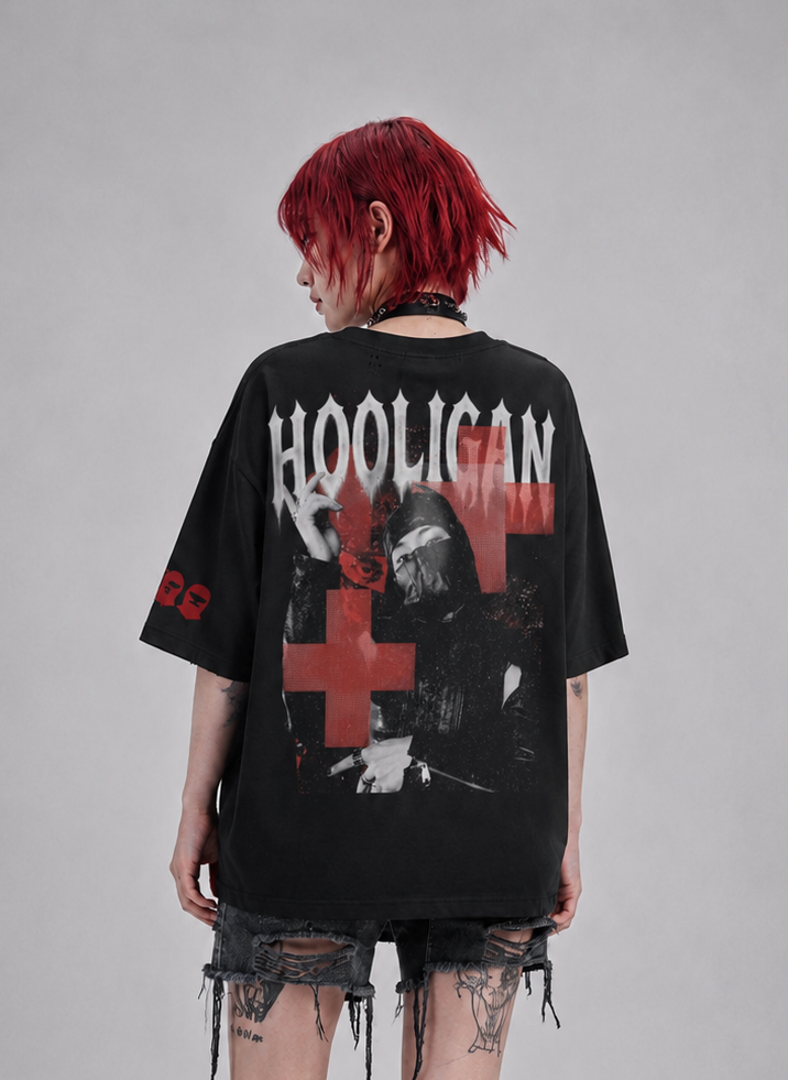 Person wearing a black t-shirt with 'HOOLIGAN' text and graphics, standing against a gray background.